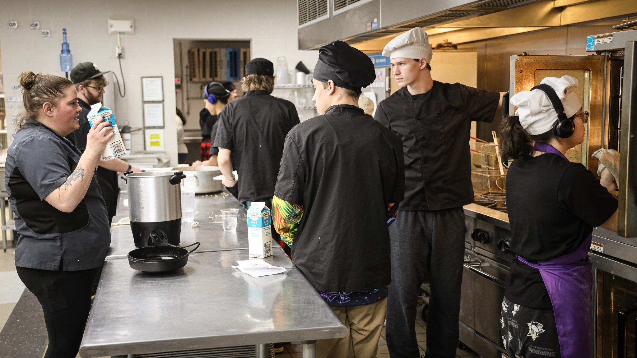 group of people in a kitchen