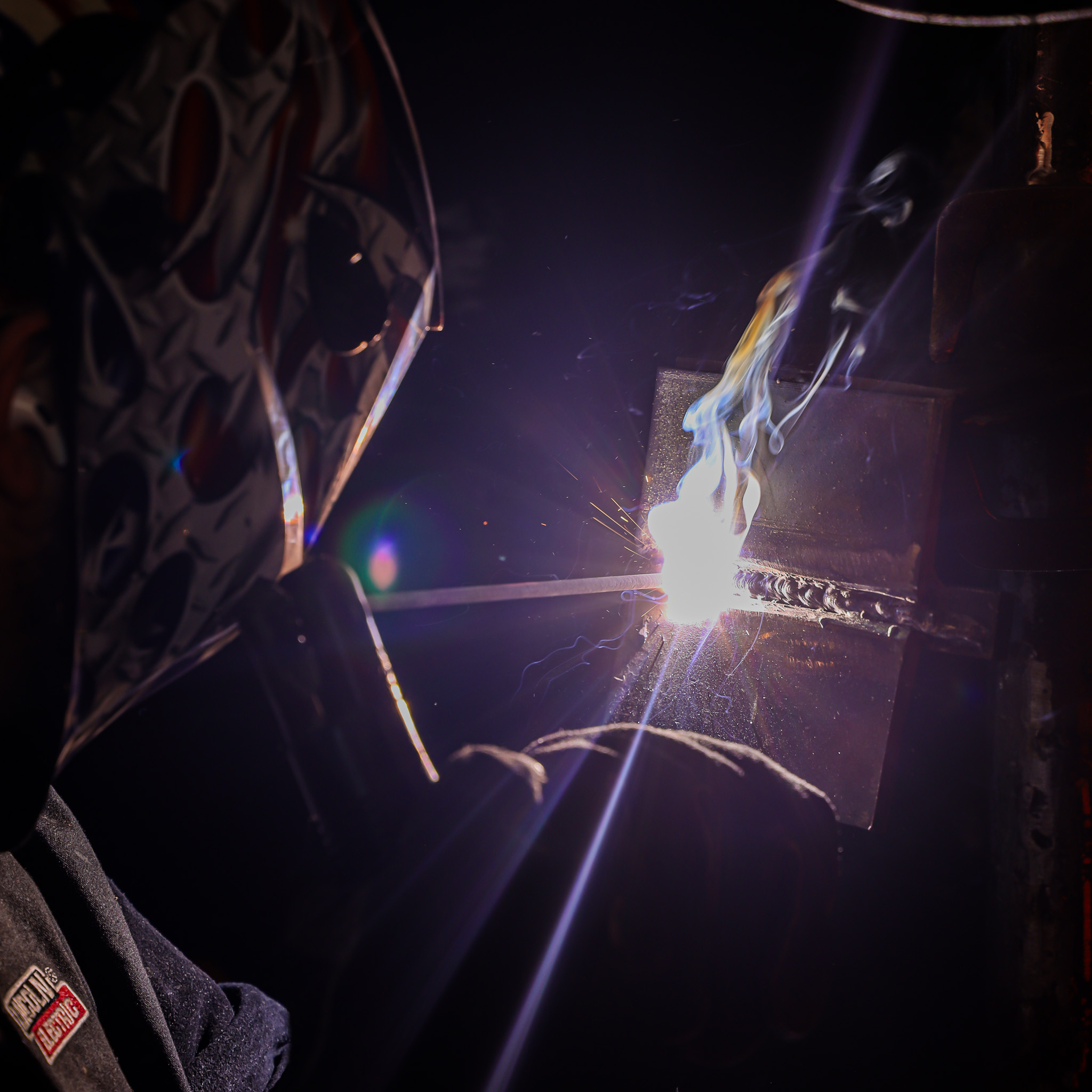 welding student using blow torch
