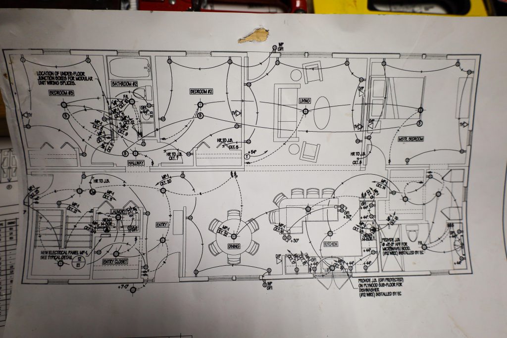 modular home specs sheet, you see a drawn up plan with dotted lines pointing to different locations and some calculations