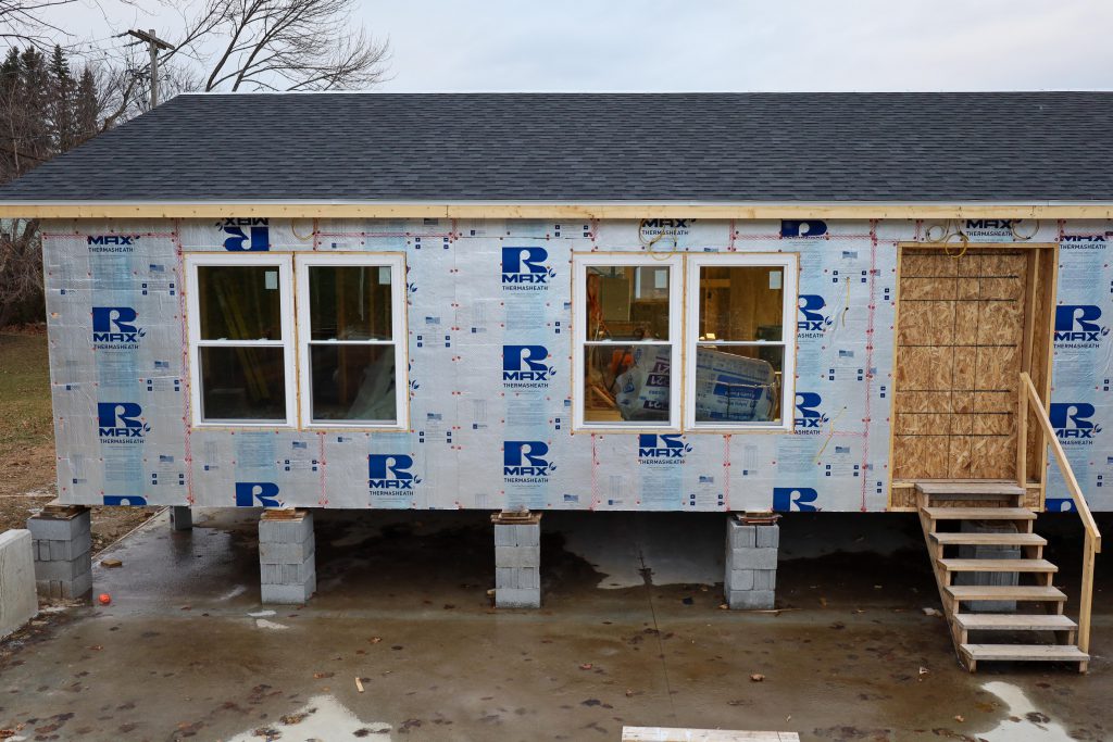student built modular home, unfinished, you see two windows aside an entrance where a door will be added