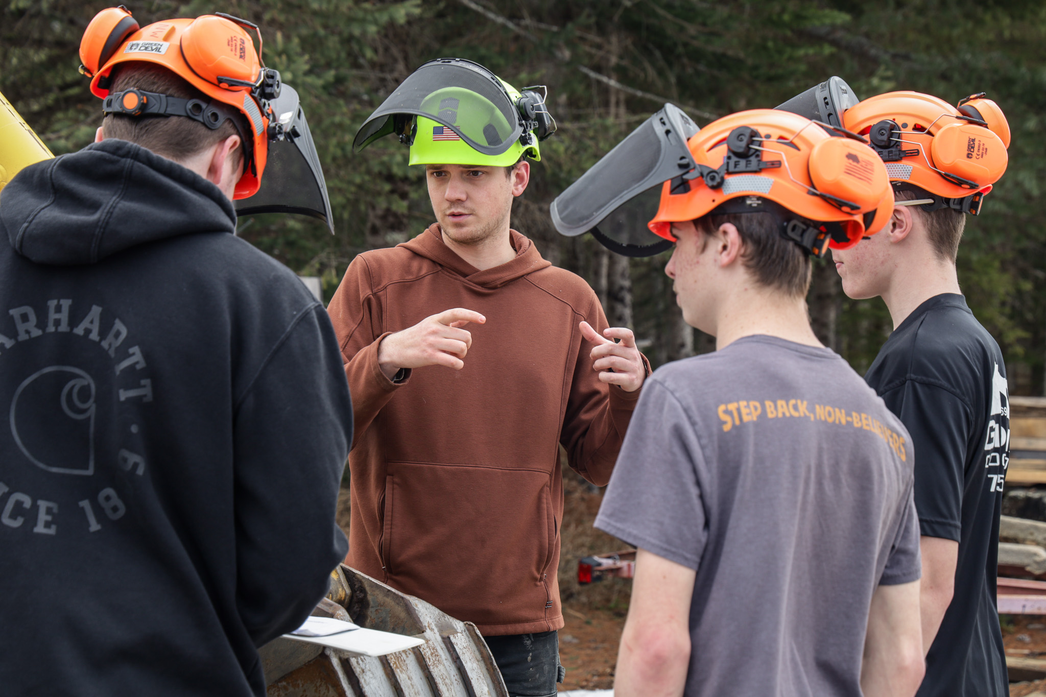 natural resource science students talking with instructor