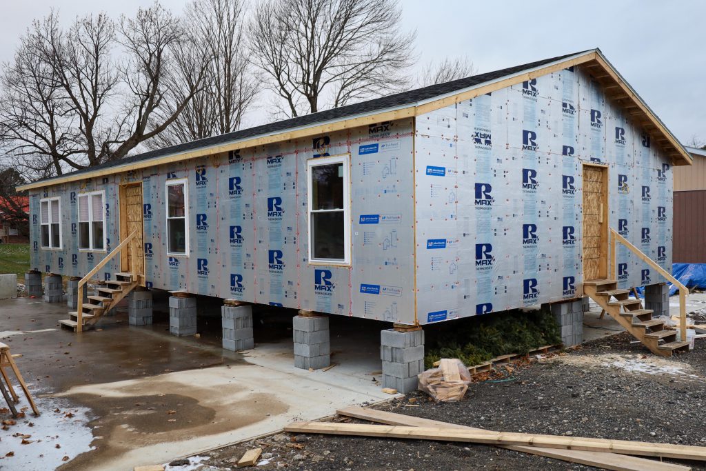 another angle of the student built modular home, shows four windows and two locations where doors will go