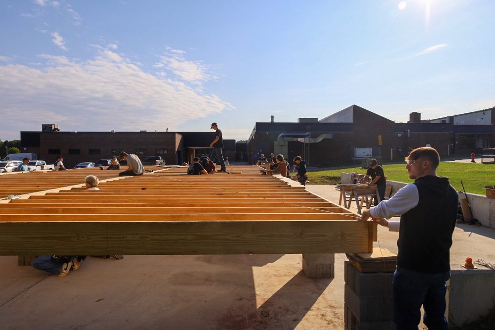 Trade Students working together on a modular home