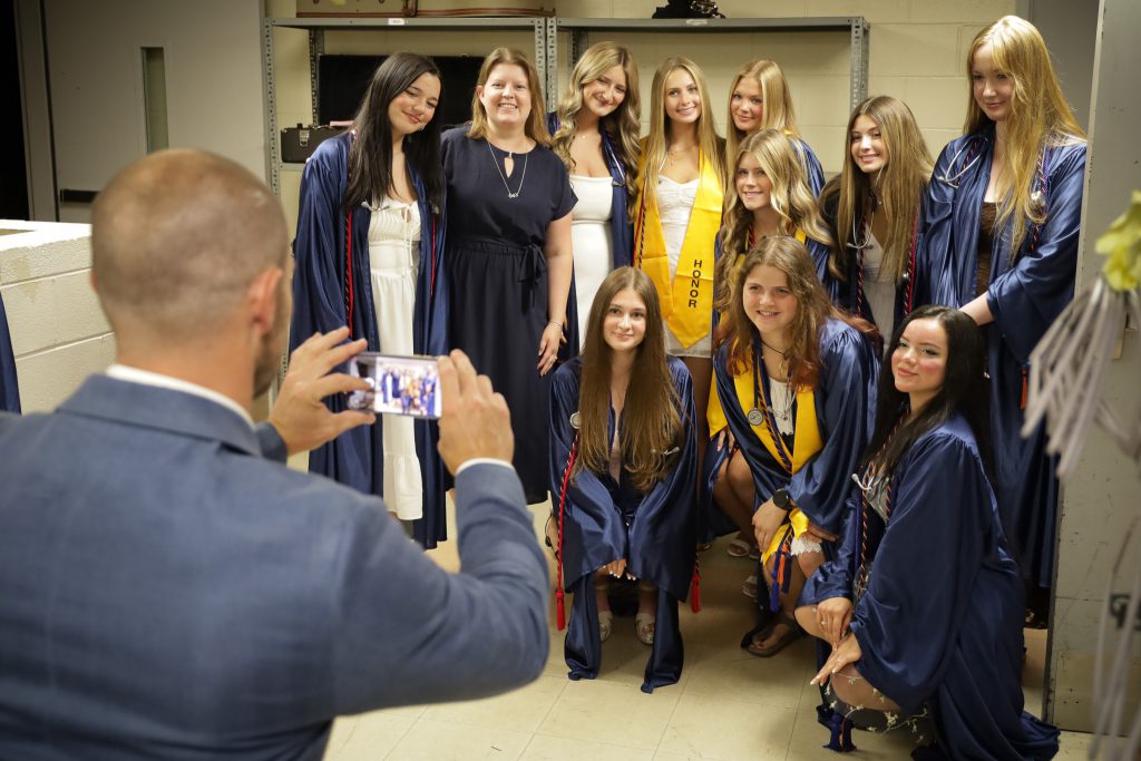 Instructor uses phone to take a picture of NV Health Exploration program