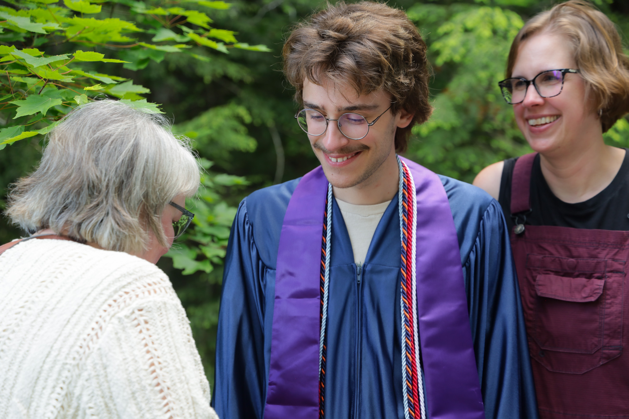 Graduate talking with loved ones