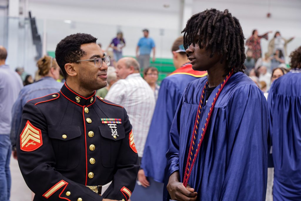 US Marine talking with JET program graduate after ceremony