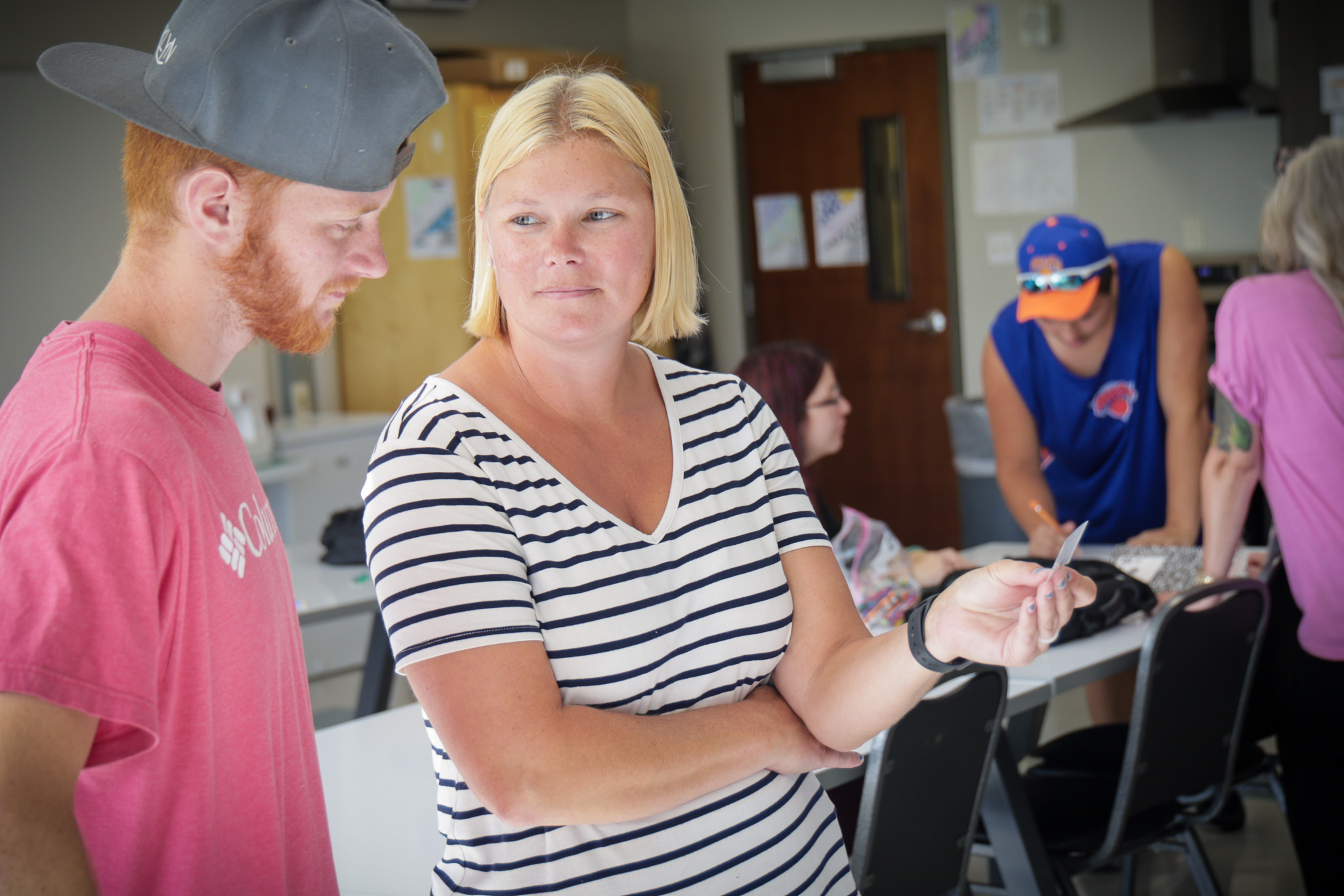 JET instructor and student playing game in classroom