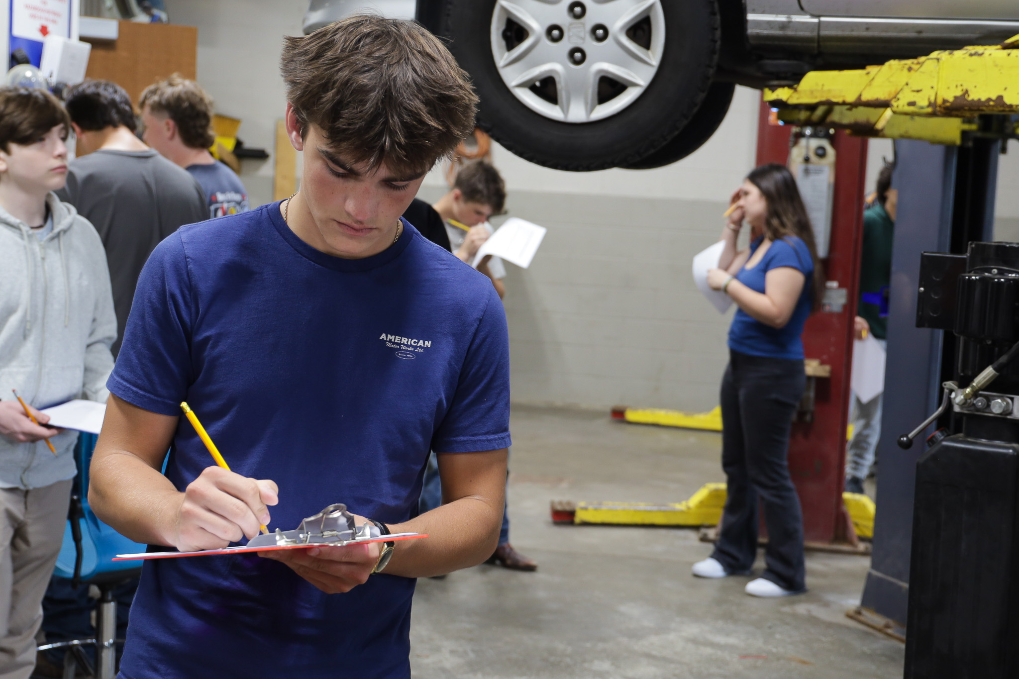 auto trade students completing checklist